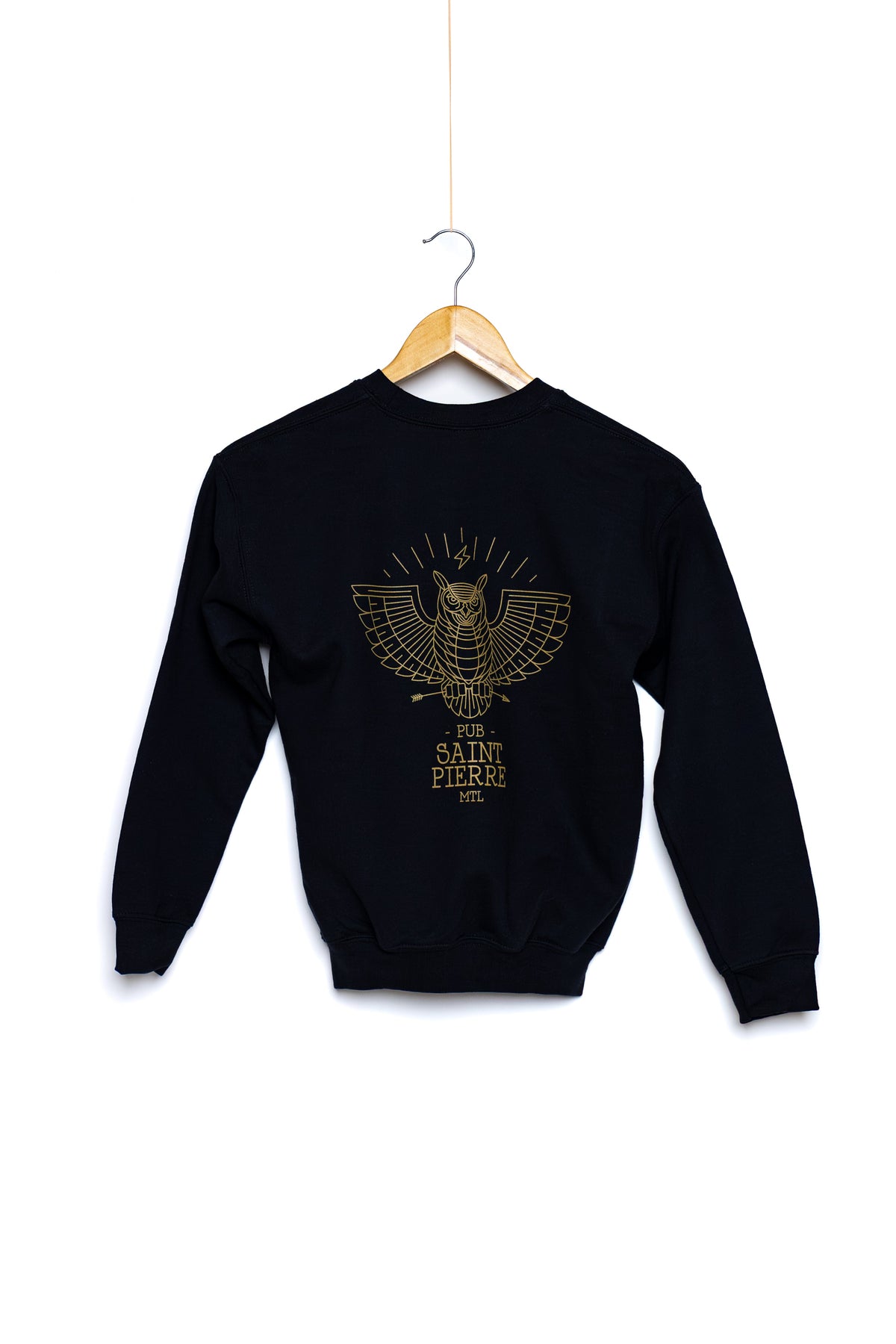 Back of the kids Pub Saint Pierre crewneck on a white background, gold owl graphic