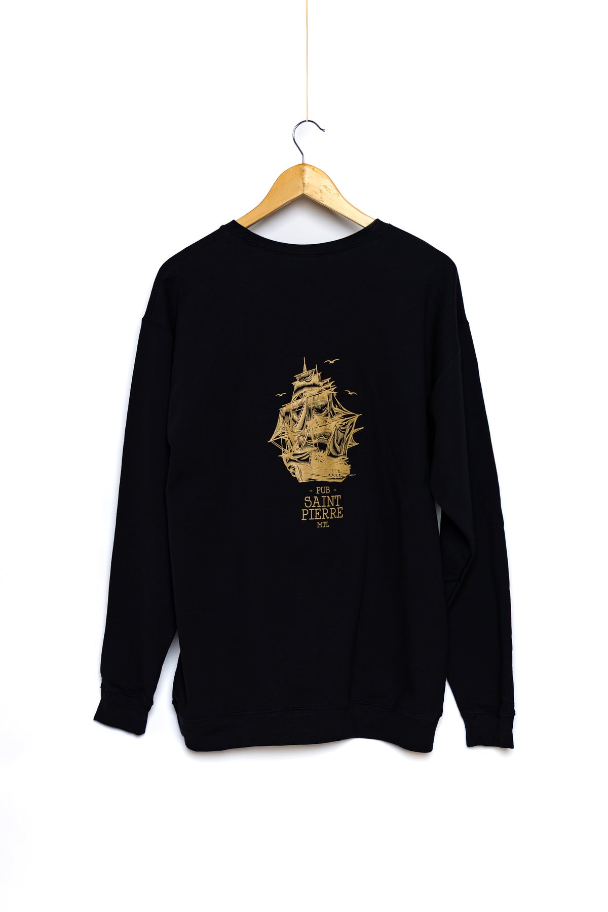 Back of the black Pub Saint Pierre crewneck sweatshirt on a white background, gold tall ship and wordmark