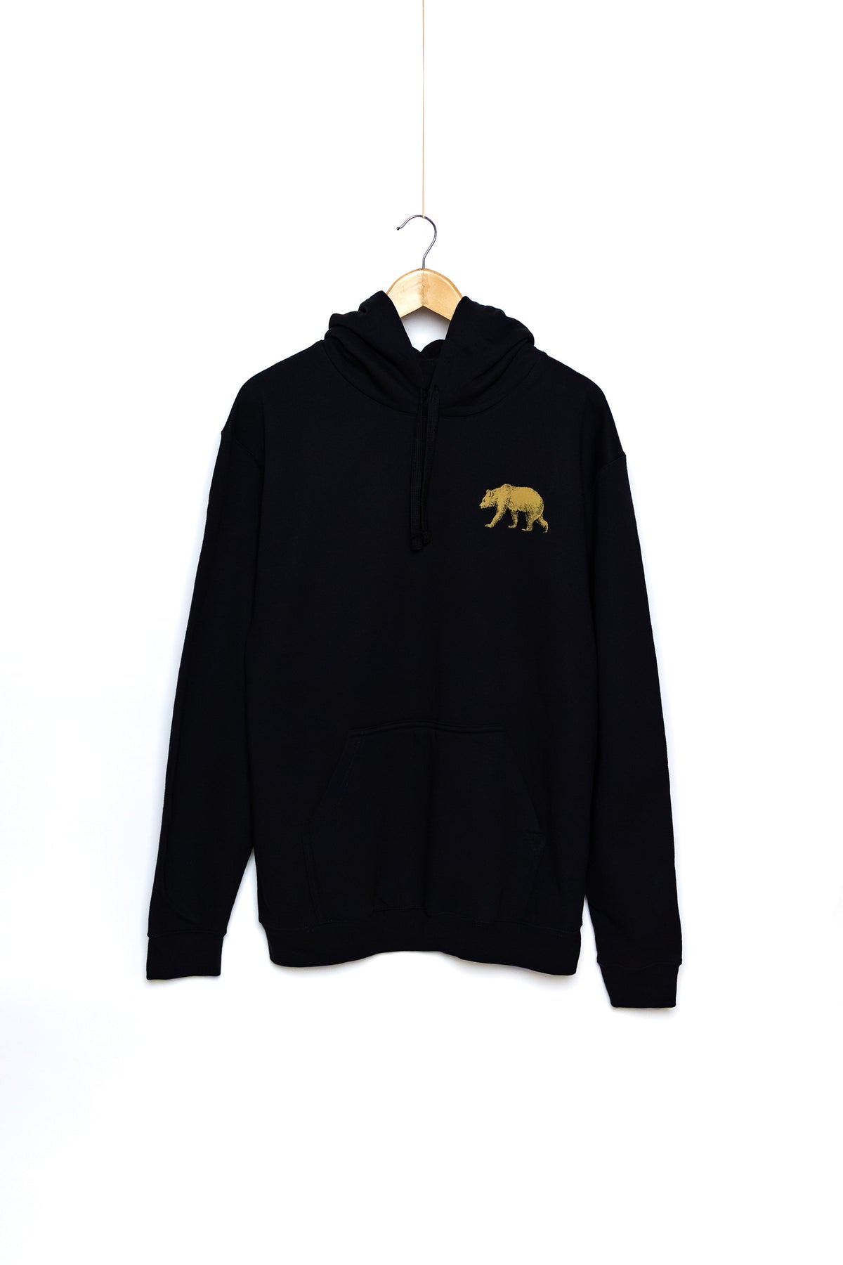 Front of the black Pub Saint Pierre pullover hoodie on a white background, gold bear at the chest